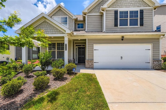 2486 Bear Mountain St, Lithonia, GA 30058 - craftsman inspired home featuring an attached garage, driveway, and brick siding