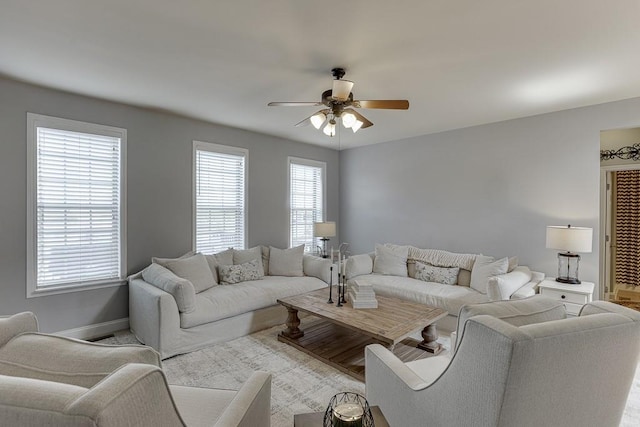 living room with a healthy amount of sunlight and ceiling fan