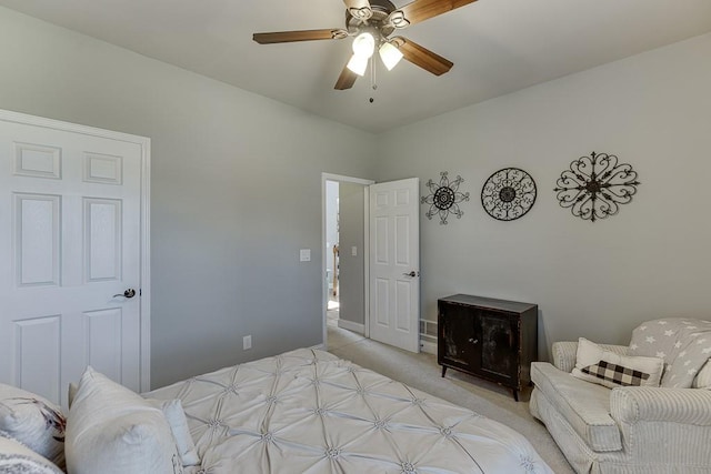 bedroom featuring light colored carpet and ceiling fan