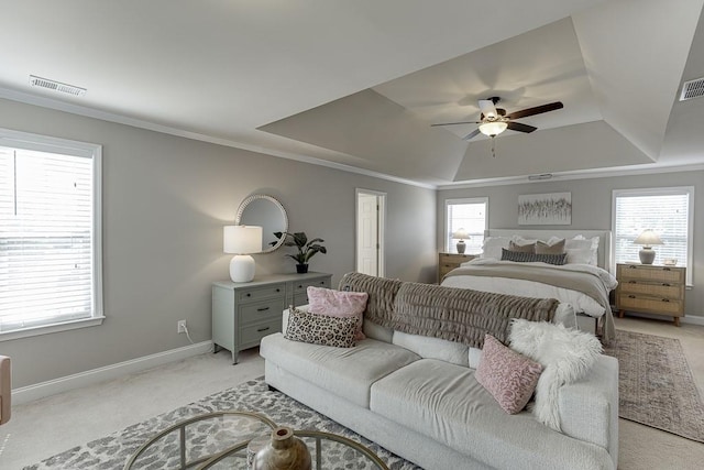 bedroom featuring ornamental molding, ceiling fan, multiple windows, and light colored carpet