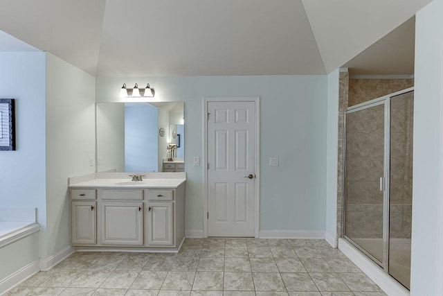 bathroom featuring walk in shower, vanity, and tile patterned floors