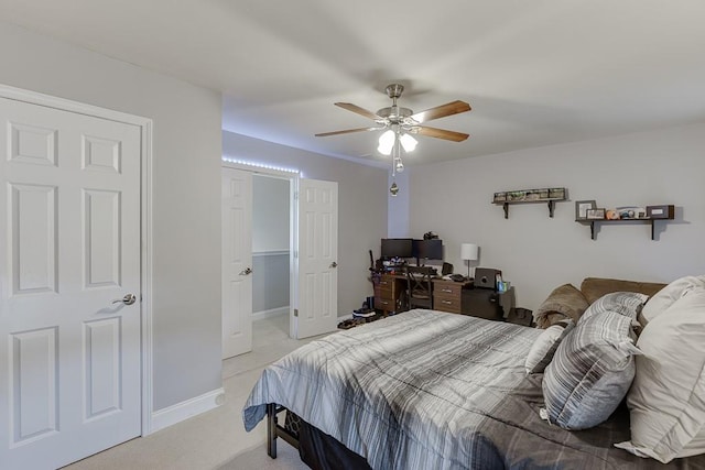 bedroom with ceiling fan and light colored carpet