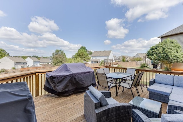 back of property with a wooden deck and a lawn