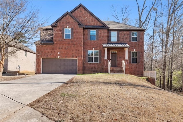 view of front of property with a front lawn, brick siding, an attached garage, and driveway