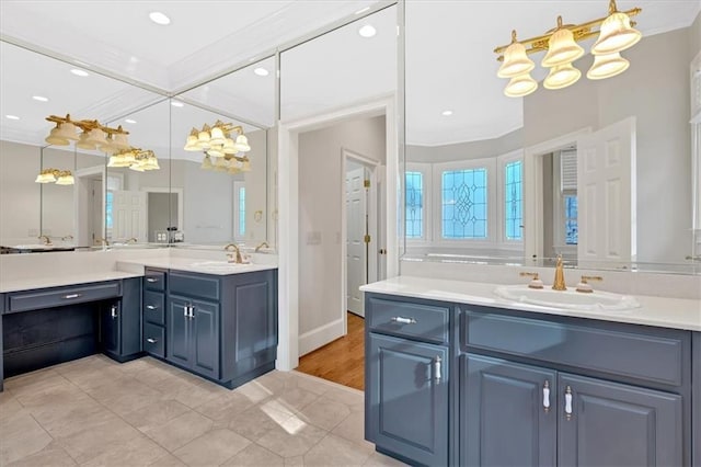 bathroom featuring crown molding, a sink, tile patterned flooring, two vanities, and recessed lighting
