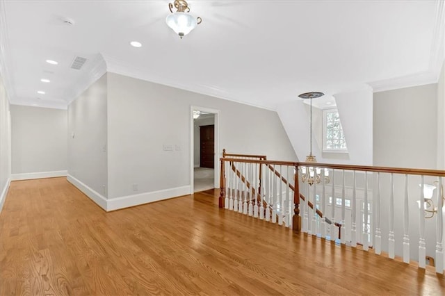 additional living space featuring baseboards, a notable chandelier, wood finished floors, and recessed lighting