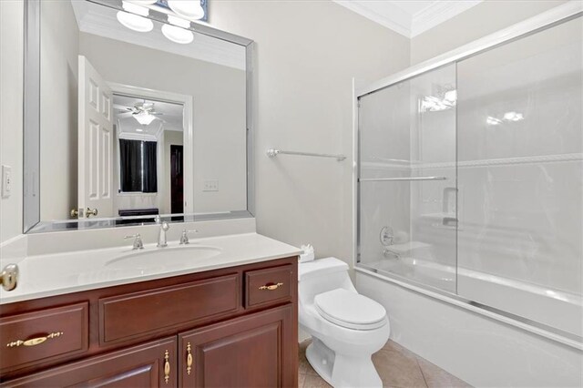 full bathroom featuring tile patterned flooring, combined bath / shower with glass door, toilet, vanity, and crown molding