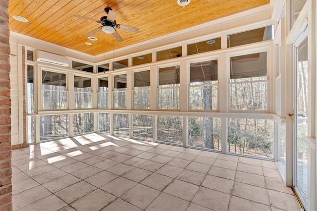 unfurnished sunroom with a wall mounted air conditioner and ceiling fan