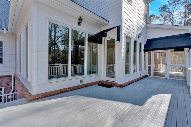 wooden terrace featuring a sunroom