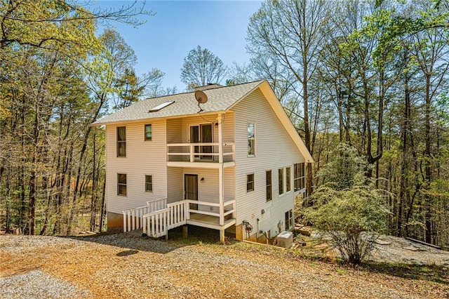 227 River Ridge Rd S, Dahlonega, GA 30533 - rear view of house with roof with shingles and a balcony