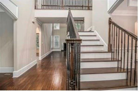 4519 Mossey Dr, Lithonia, GA 30038 - staircase with wood finished floors and baseboards