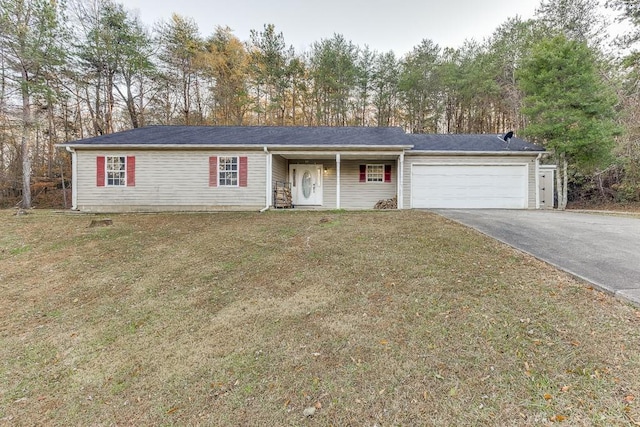 ranch-style home featuring a garage and a front lawn