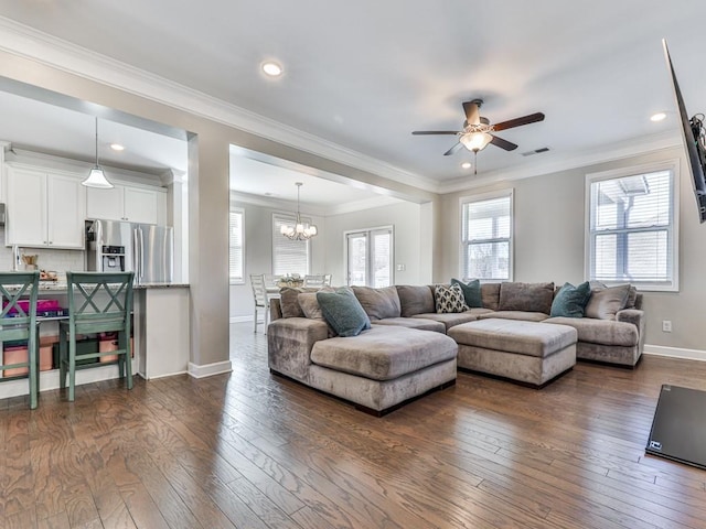 living room with visible vents, crown molding, dark wood-type flooring, and baseboards