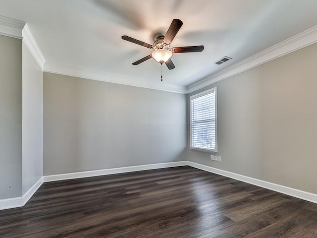 spare room featuring dark wood-style floors, visible vents, and baseboards