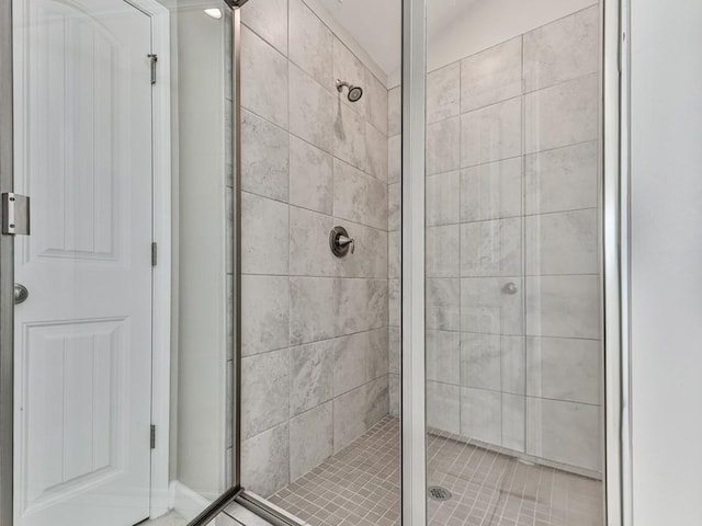 bathroom featuring a shower stall