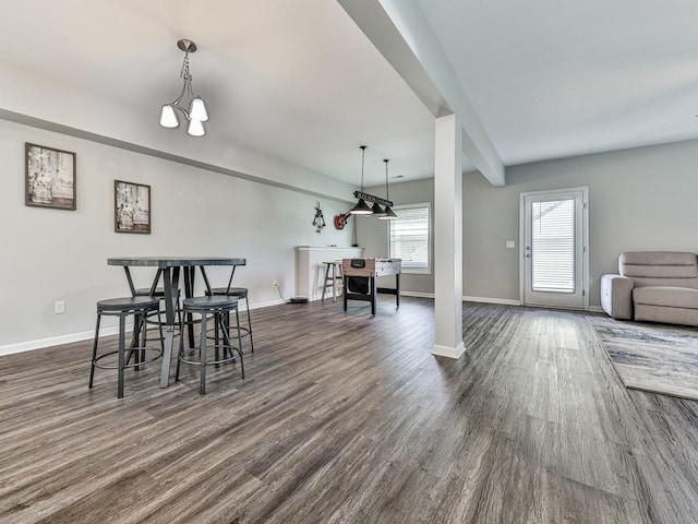 dining room with baseboards and dark wood-style floors