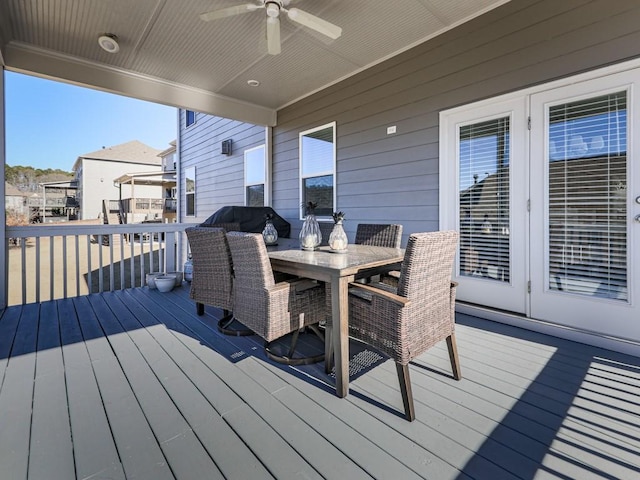 deck with ceiling fan and outdoor dining space