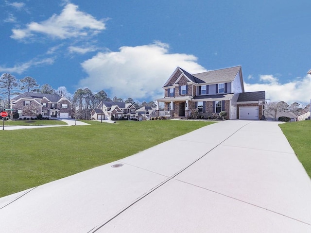 view of front of house with a residential view, driveway, a garage, and a front yard