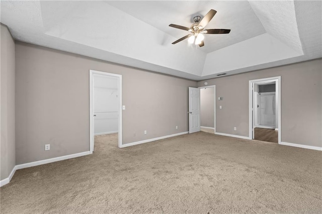 470 Piney Way SW, Atlanta, GA 30331 - unfurnished bedroom with a tray ceiling, carpet flooring, baseboards, and a walk in closet