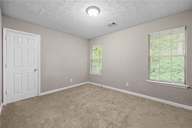 470 Piney Way SW, Atlanta, GA 30331 - empty room with carpet flooring, baseboards, and a textured ceiling