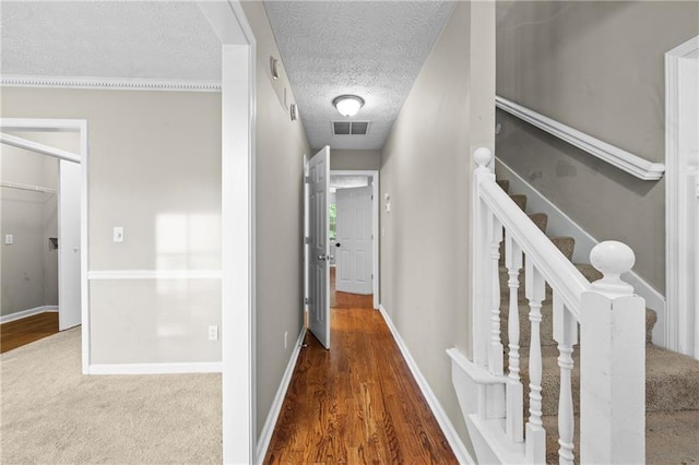 470 Piney Way SW, Atlanta, GA 30331 - corridor featuring a textured ceiling, wood finished floors, baseboards, and stairway