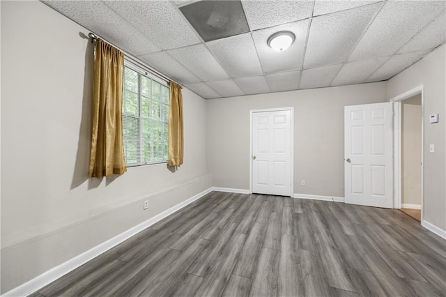 470 Piney Way SW, Atlanta, GA 30331 - spare room featuring dark wood-type flooring, a paneled ceiling, and baseboards