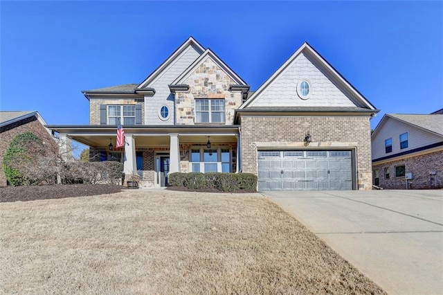 craftsman-style home featuring covered porch and a garage