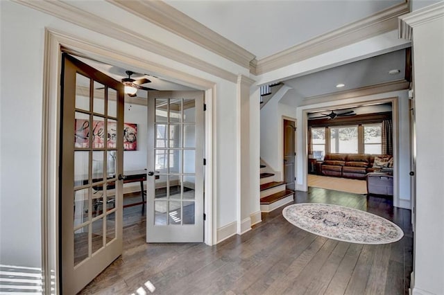 interior space with ornamental molding, dark wood-type flooring, and french doors