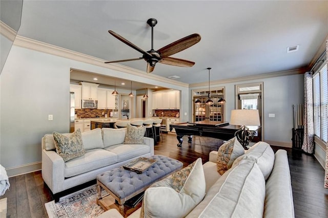 living room with crown molding, billiards, dark hardwood / wood-style flooring, and ceiling fan