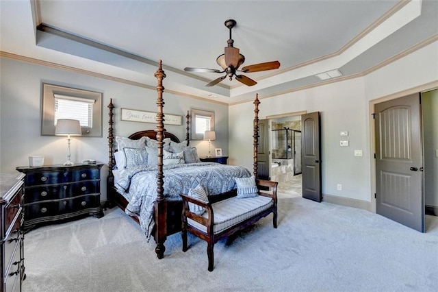 bedroom featuring light carpet, crown molding, ceiling fan, and a raised ceiling