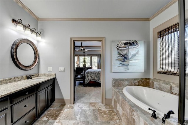 bathroom featuring tiled bath, vanity, and crown molding