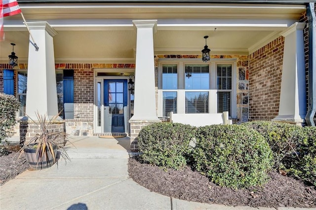 doorway to property featuring covered porch