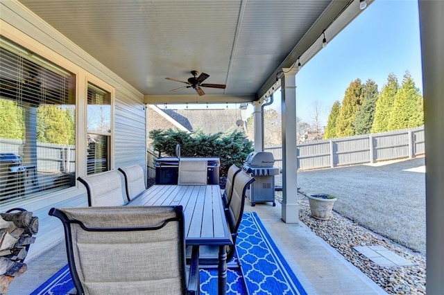 view of patio featuring area for grilling and ceiling fan