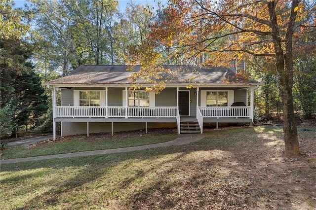 view of front of house featuring covered porch and a front lawn