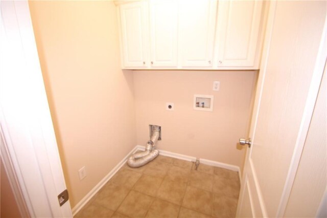 2610 Gadsen Walk, Duluth, GA 30097 - washroom featuring light tile patterned floors, cabinet space, baseboards, hookup for an electric dryer, and washer hookup
