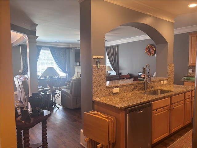 kitchen with dishwasher, light stone counters, open floor plan, a peninsula, and a sink