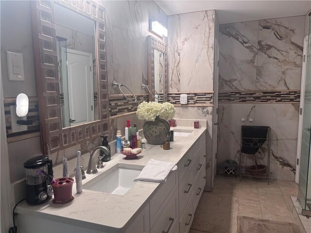 2610 Gadsen Walk, Duluth, GA 30097 - bathroom with tile walls, double vanity, backsplash, a stall shower, and a sink