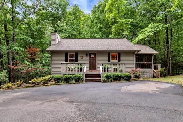 view of front of property featuring a sunroom