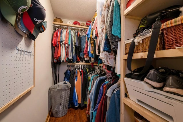 spacious closet featuring hardwood / wood-style floors