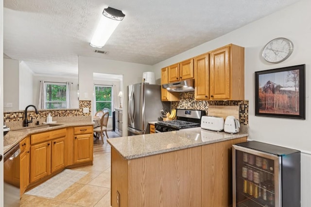 2277 Lazy Days Rd, Dacula, GA 30019 - kitchen featuring beverage cooler, stainless steel appliances, a sink, under cabinet range hood, and a peninsula