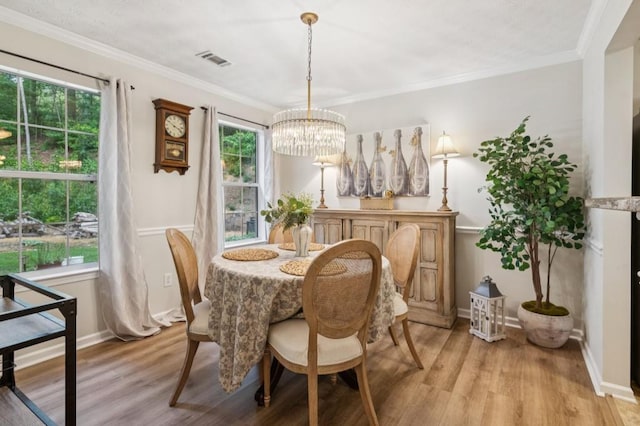 2277 Lazy Days Rd, Dacula, GA 30019 - dining room featuring a chandelier, light wood-style flooring, ornamental molding, and baseboards