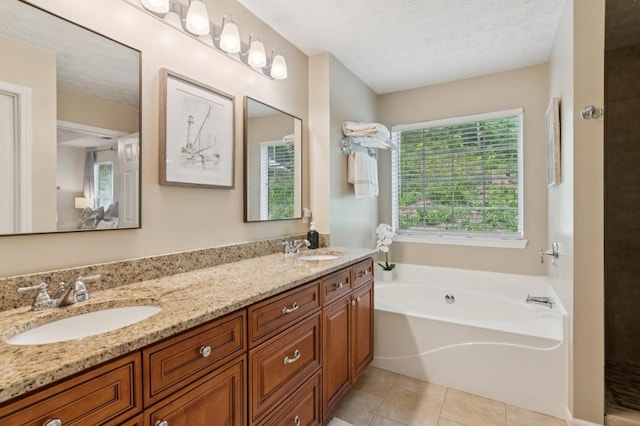 2277 Lazy Days Rd, Dacula, GA 30019 - bathroom featuring a garden tub, double vanity, tile patterned floors, and tiled shower
