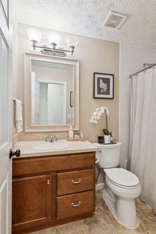 2277 Lazy Days Rd, Dacula, GA 30019 - full bathroom featuring vanity, toilet, a textured ceiling, and curtained shower