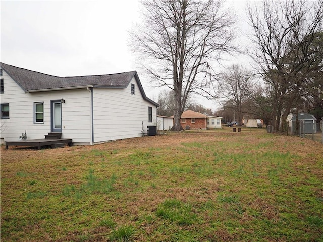 view of yard featuring central air condition unit