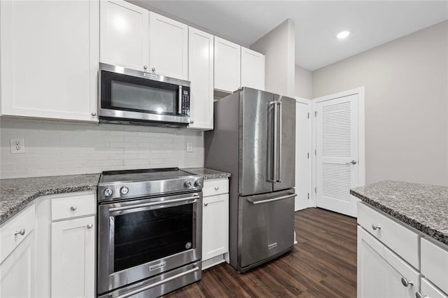 840 United Ave SE Unit 401, Atlanta, GA 30312 - kitchen with stainless steel appliances, dark wood-style flooring, white cabinetry, and recessed lighting