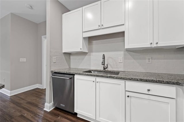 840 United Ave SE Unit 401, Atlanta, GA 30312 - kitchen featuring stainless steel dishwasher, a sink, stone counters, baseboards, and white cabinetry