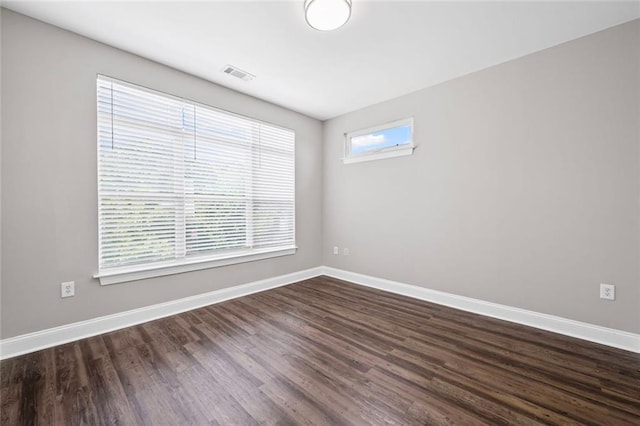 840 United Ave SE Unit 401, Atlanta, GA 30312 - unfurnished room with baseboards and dark wood-style flooring