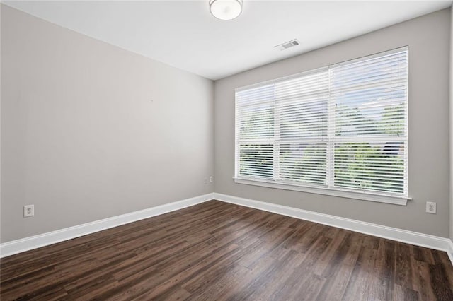 840 United Ave SE Unit 401, Atlanta, GA 30312 - spare room with baseboards and dark wood-style flooring