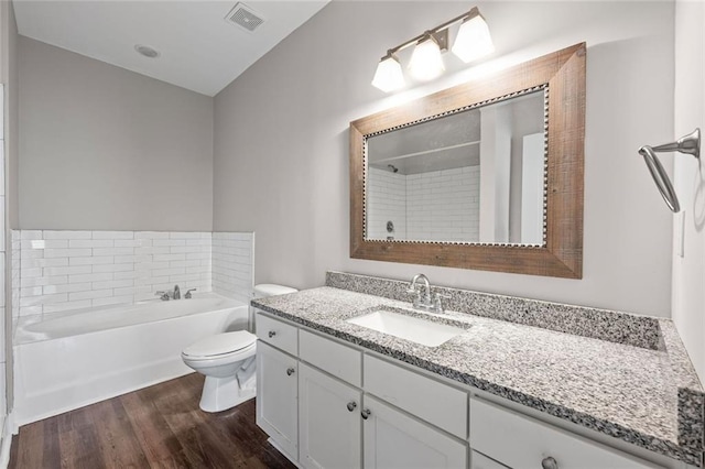 840 United Ave SE Unit 401, Atlanta, GA 30312 - full bath featuring a garden tub, vanity, toilet, and wood finished floors
