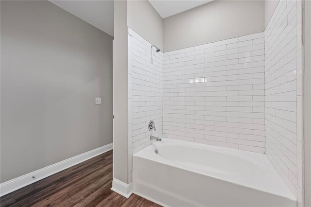 840 United Ave SE Unit 401, Atlanta, GA 30312 - bathroom featuring shower / washtub combination, baseboards, and wood finished floors